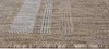 A close-up, angled view of a woven rug with a textured pattern. Náhľad obrázku produktu