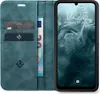 A teal flip-case wallet for a smartphone is shown open, displaying credit cards and a banknote, with the smartphone screen visible. Produktbild-Vorschau