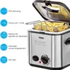 A close-up of a silver mini-deep fryer with its lid open, showing a basket of french fries inside. Text and icons describing the product's features are on the left side of the image. Produktbild-Vorschau