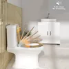 A toilet with a decorative lid in motion, shown in a modern bathroom setting. Produktbild-Vorschau