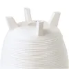 The bottom of a white planter with four legs is shown against a white background. Produktbild-Vorschau