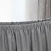 A close-up view of the elasticated waistband of a gray fabric product, possibly a stool cover or clothing. Produktbild-Vorschau