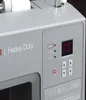 A close-up view of the control panel of a gray sewing machine, showing a digital display, buttons, and stitch pattern indicators. Náhled obrázku produktu