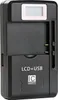 A black universal battery charger with an LCD screen and USB port. Produktbild-Vorschau