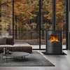 A modern living room with a fireplace and large windows overlooking an autumn forest. Produktbild-Vorschau