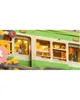 A close-up view of a model train station with a person inside the train. Produktbild-Vorschau