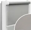 A close-up view of a gray roller blind installed on a white window frame.