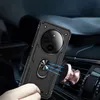 A hand holding a black phone case with a ring holder, which is magnetically attached to a car vent mount. Produktbild-Vorschau