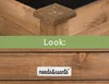 A close-up view of a wooden raised garden bed, showing the texture and construction details. Produktbild-Vorschau
