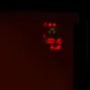 A close-up of a digital display showing temperature, timer, and flame intensity. Podgląd zdjęcia produktu