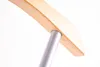 A close-up shot of the connection between a wooden element and a silver metal pole, likely part of a piece of furniture or a valet stand. Anteprima dell’immagine prodotto