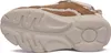 Side view of a beige and brown sneaker with a thick sole. Podgląd zdjęcia produktu