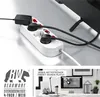 A white power strip with multiple black plugs connected, shown from a close-up angle, with a second image below showing a desk setup with a computer and accessories. Voir les images du produit