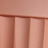A close-up view of the textured surface of a terracotta-colored planter. Náhľad obrázku produktu