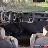 View from inside a van looking towards the front cabin, with a person lying down on a mattress in the passenger area. Náhled obrázku produktu