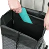 A person's hands are placing a teal-colored item into a compartment of a shopping trolley. Podgląd zdjęcia produktu