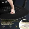 A close-up shot of a black gaming chair seat with a hand pressing into the cushion. Text overlays describe the features of the chair, and an inset diagram shows the layered construction of the seat. Produktbild-Vorschau