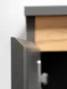 A close-up view of the edge of a cabinet door, showing the textured anthracite finish and the wooden interior. Náhled obrázku produktu