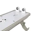 A close-up view of the interior of a light fixture, showing the sockets for fluorescent tubes and a latch mechanism. Podgląd zdjęcia produktu