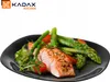 A black plate with a serving of salmon and asparagus. Anteprima dell’immagine prodotto