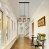 A hallway with a chandelier, windows, and a bench. Anteprima dell’immagine prodotto