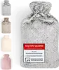 A collage of hot water bottles, with a large one in the foreground and four smaller ones on the left. Anteprima dell’immagine prodotto