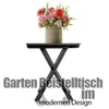 A small black folding table with a vase of flowers on top, set against a white background with text overlay. Produktbild-Vorschau