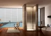 A modern bathroom with a large window overlooking the ocean, featuring a shower enclosure. Produktbild-Vorschau