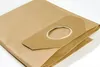 A close-up shot of a folded brown paper vacuum cleaner bag on a white background. Produktbild-Vorschau
