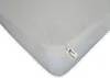 A white mattress protector with a tag indicating it is made in Germany. Produktbild-Vorschau