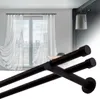A double curtain rod is shown in the foreground, with sheer white curtains hanging in front of a window in the background. Produktbild-Vorschau
