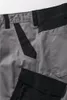 A close-up view of the waistband and pockets of gray shorts with black accents. Produktbild-Vorschau