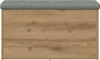 A storage bench with a tufted gray upholstered top and a wood-grain effect front panel. Produktbild-Vorschau