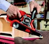 A person is using a Black & Decker belt sander on a piece of wood in a workshop setting. Anteprima dell’immagine prodotto