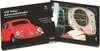 A product box for a VW Beetle advent calendar, showing the front of the box with a red VW Beetle illustration and the open box revealing the advent calendar grid with a close-up of the car's dashboard. Produktbild-Vorschau
