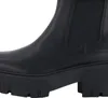 A close-up view of the side of a black Chelsea boot with a thick platform sole. Anteprima dell’immagine prodotto