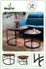 Two round coffee tables are placed in a living room setting with a blue sofa and a plant. Produktbild-Vorschau