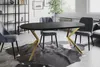 A dining room setting with an oval table and chairs. Anteprima dell’immagine prodotto