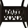 A close-up view of the decorative metalwork on the base of a table. Náhľad obrázku produktu