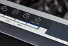 A close-up view of a dishwasher control panel with various icons and temperature settings. Anteprima dell’immagine prodotto