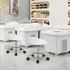 A beauty salon or spa setting with multiple treatment beds and stools. Produktbild-Vorschau
