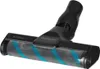 A close-up view of a vacuum cleaner head with a brush roll. Produktbild-Vorschau