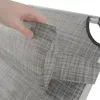 A hand is shown holding and demonstrating the fabric of a gray striped camping chair. Produktbild-Vorschau