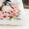 A close-up watercolor illustration of a penguin surrounded by pink flowers. Produktbild-Vorschau
