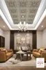 A modern living room with two sofas, a coffee table, and a decorative ceiling. Produktbild-Vorschau