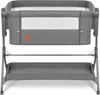 A gray baby bassinet with a mesh window and a storage tray underneath, shown on a white background. Produktbild-Vorschau