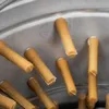 A close-up view of multiple rubber teat cups inside a metal machine. Podgląd zdjęcia produktu