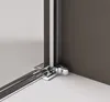 A close-up view of the corner of a shower enclosure, showing the chrome-plated metal fittings and the junction of the glass and wall. Produktbild-Vorschau
