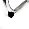 A close-up of a metal object with a black rubber foot. Voir les images du produit