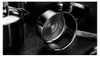 A close-up shot of several stainless steel pots and pans on a dark, textured surface. Náhled obrázku produktu